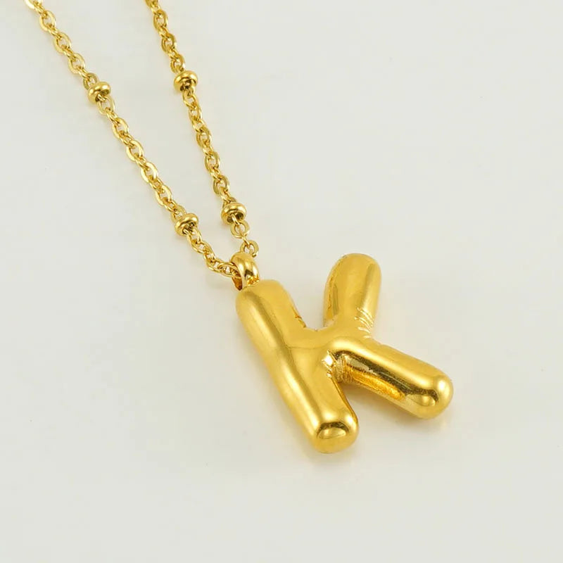 Collar especial de luz dorado de 18 quilates con esfera especial y letra inicial