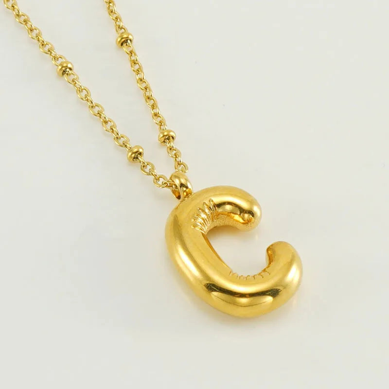 Collar especial de luz dorado de 18 quilates con esfera especial y letra inicial