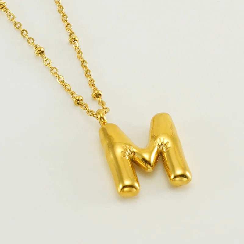 Collar especial de luz dorado de 18 quilates con esfera especial y letra inicial