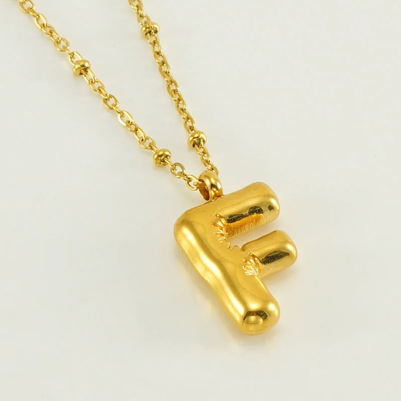 Collar especial de luz dorado de 18 quilates con esfera especial y letra inicial