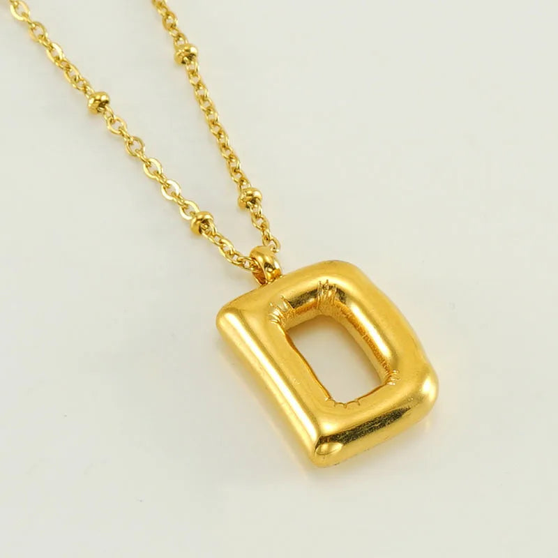 Collar especial de luz dorado de 18 quilates con esfera especial y letra inicial