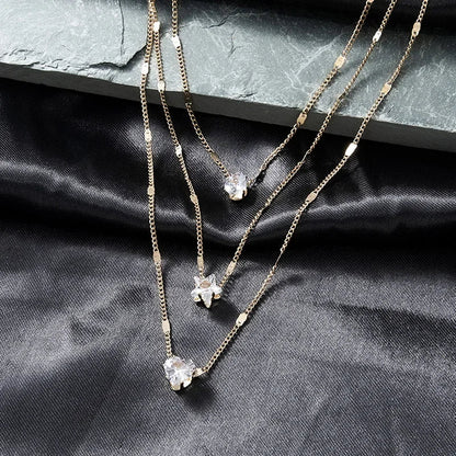 Collar Multicapa Triple con Dijes de Zirconia