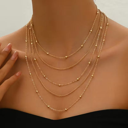 Collar Cadena Multicapa con Borlas Elegantes