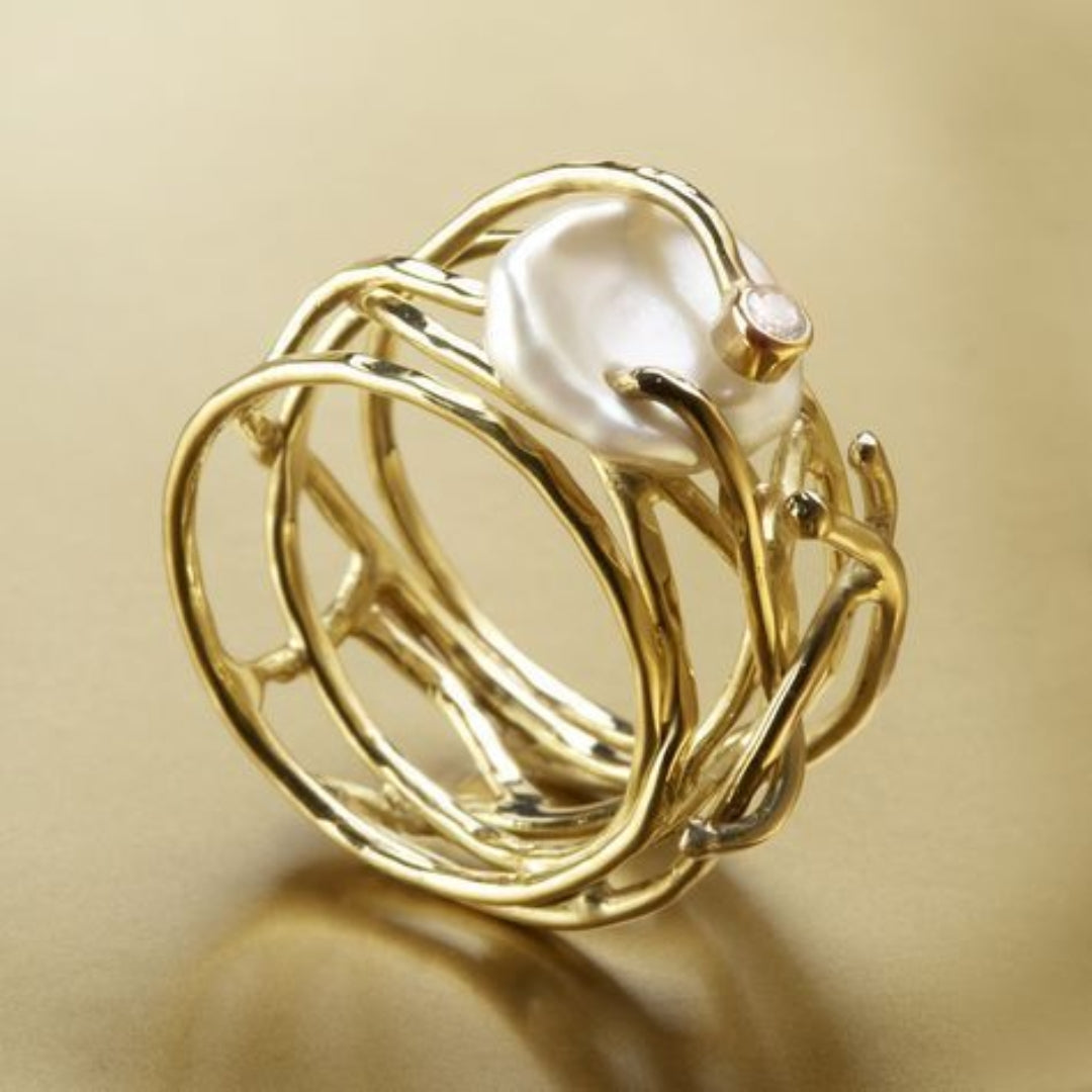 Anillo vintage fino dorado y perla