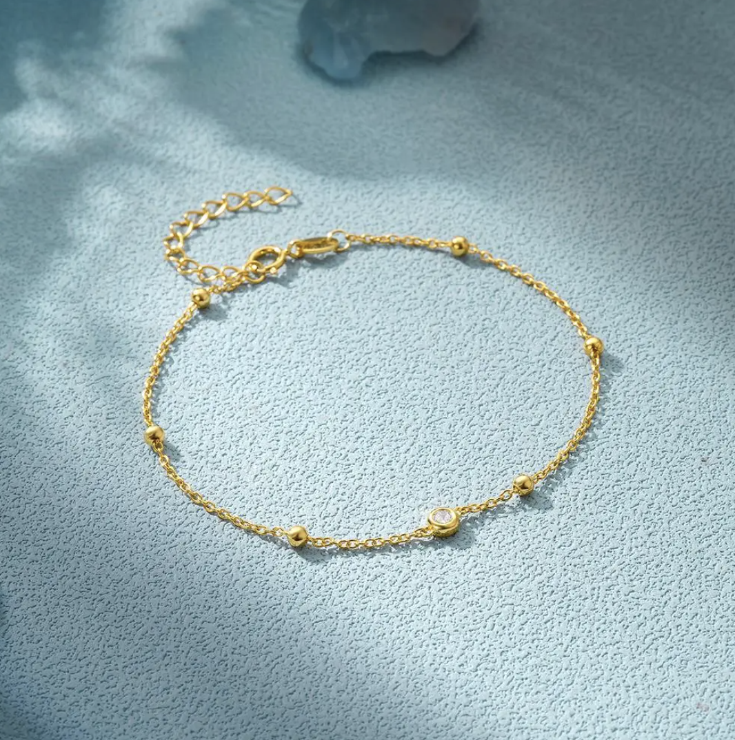 Pulsera chapada en oro de 18 quilates con ojo y perlas de circonita