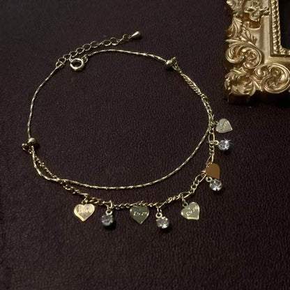 Tobillera de cadena con corazón dorado