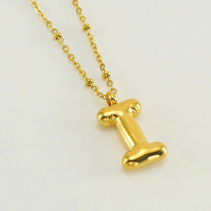 Collar especial de luz dorado de 18 quilates con esfera especial y letra inicial