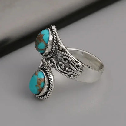 Elegante Anillo Vintage Cruzado de Turquesa